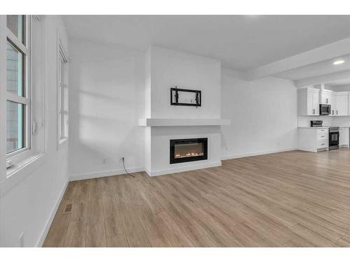 155 Wolf Creek Avenue Se, Calgary, AB - Indoor Photo Showing Living Room With Fireplace