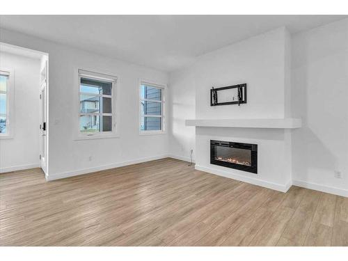 155 Wolf Creek Avenue Se, Calgary, AB - Indoor Photo Showing Living Room With Fireplace