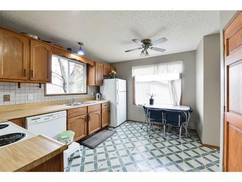 1052 Abbeydale Drive Ne, Calgary, AB - Indoor Photo Showing Kitchen With Double Sink