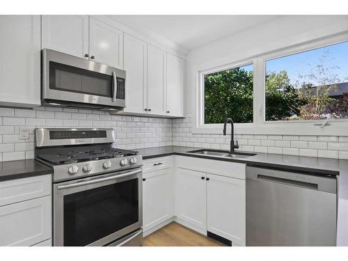 7 Deerbow Place Se, Calgary, AB - Indoor Photo Showing Kitchen With Double Sink