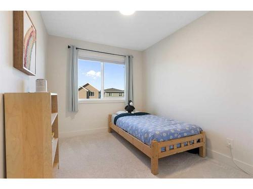 117 Heartland Street, Cochrane, AB - Indoor Photo Showing Bedroom