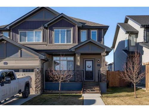 117 Heartland Street, Cochrane, AB - Outdoor With Facade