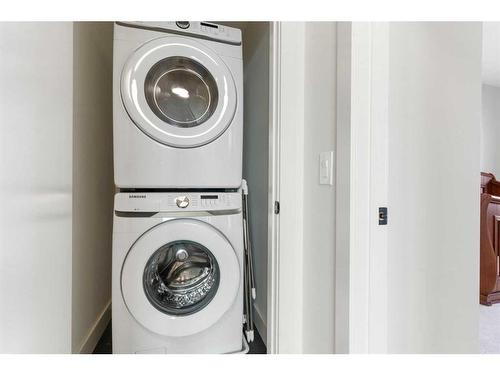 117 Heartland Street, Cochrane, AB - Indoor Photo Showing Laundry Room