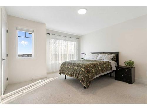 117 Heartland Street, Cochrane, AB - Indoor Photo Showing Bedroom