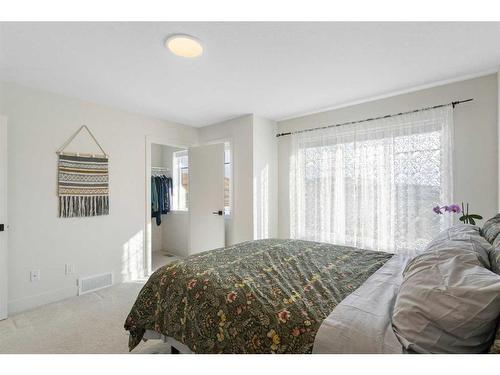 117 Heartland Street, Cochrane, AB - Indoor Photo Showing Bedroom