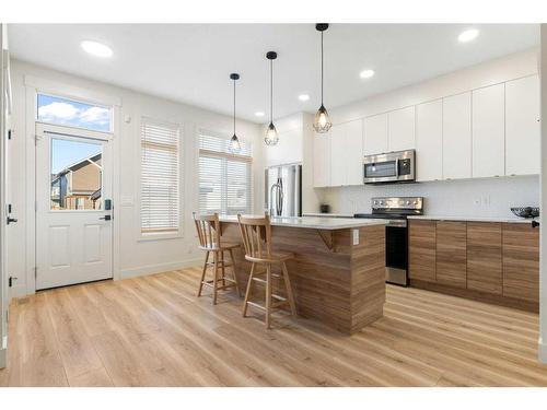 117 Heartland Street, Cochrane, AB - Indoor Photo Showing Kitchen With Stainless Steel Kitchen With Upgraded Kitchen