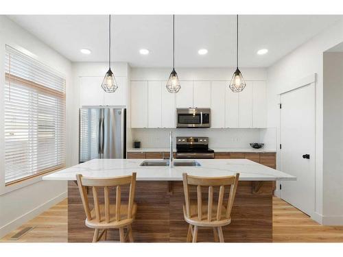 117 Heartland Street, Cochrane, AB - Indoor Photo Showing Kitchen With Stainless Steel Kitchen With Upgraded Kitchen