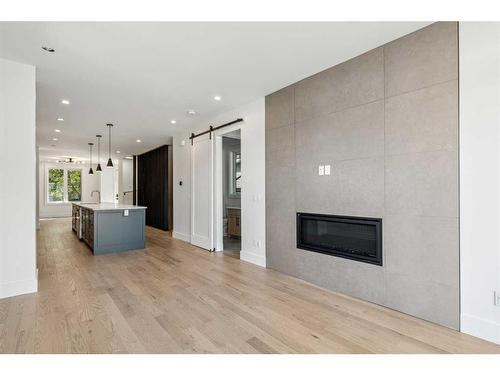 438 28 Avenue Nw, Calgary, AB - Indoor Photo Showing Living Room With Fireplace