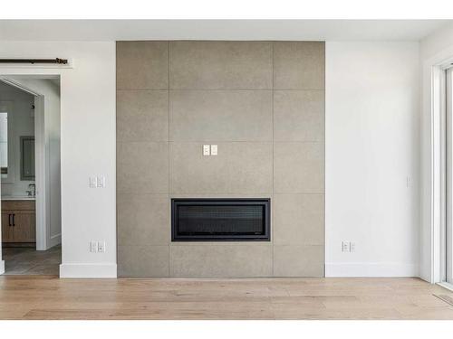 438 28 Avenue Nw, Calgary, AB - Indoor Photo Showing Living Room With Fireplace