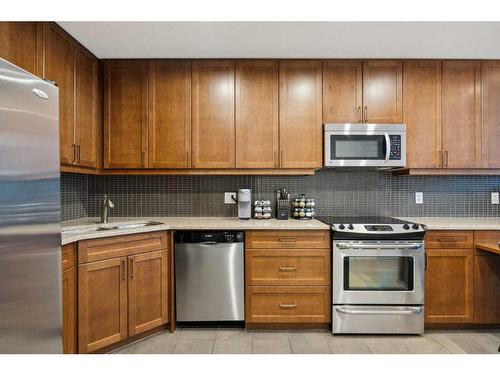 201-211 13 Avenue Se, Calgary, AB - Indoor Photo Showing Kitchen With Stainless Steel Kitchen