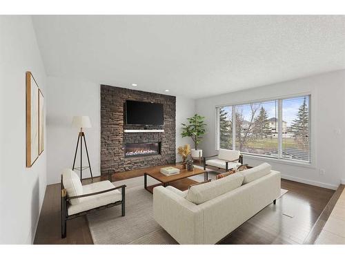 505 Lakeside Greens Place, Chestermere, AB - Indoor Photo Showing Living Room With Fireplace