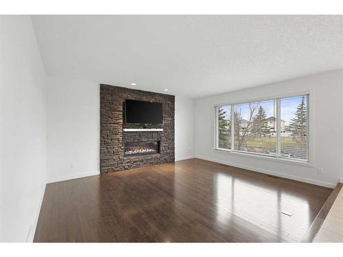 505 Lakeside Greens Place, Chestermere, AB - Indoor Photo Showing Living Room With Fireplace