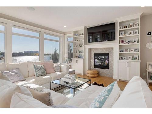 71 Auburn Sound Cove Se, Calgary, AB - Indoor Photo Showing Living Room With Fireplace