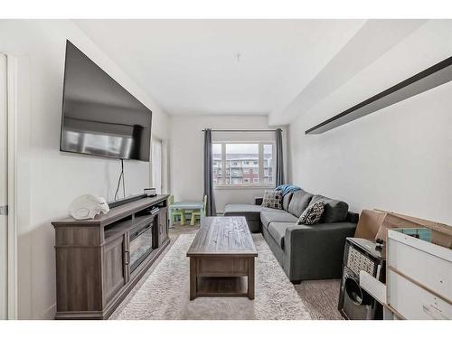 304-23 Millrise Drive Sw, Calgary, AB - Indoor Photo Showing Living Room