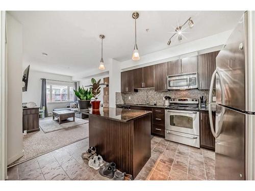 304-23 Millrise Drive Sw, Calgary, AB - Indoor Photo Showing Kitchen With Stainless Steel Kitchen With Upgraded Kitchen