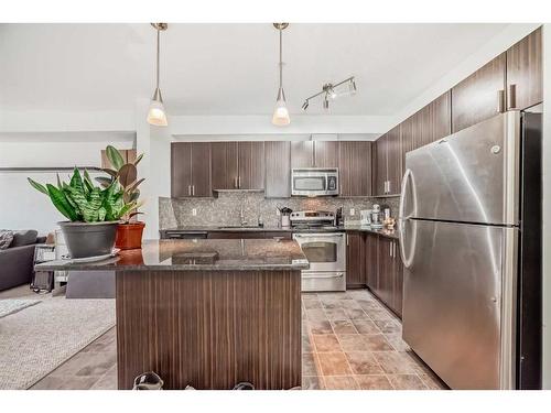 304-23 Millrise Drive Sw, Calgary, AB - Indoor Photo Showing Kitchen With Stainless Steel Kitchen With Double Sink With Upgraded Kitchen