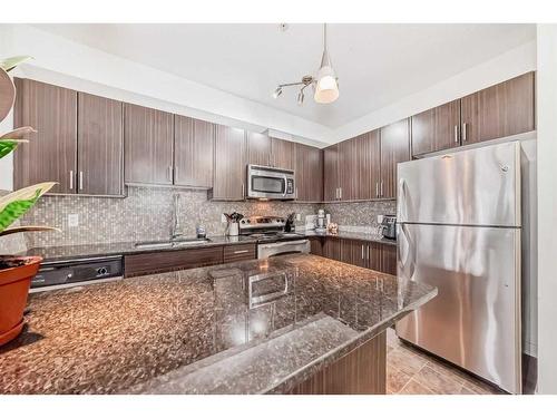 304-23 Millrise Drive Sw, Calgary, AB - Indoor Photo Showing Kitchen With Stainless Steel Kitchen With Upgraded Kitchen