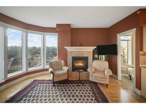 401-4 14 Street Nw, Calgary, AB - Indoor Photo Showing Living Room With Fireplace