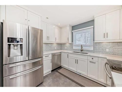 103 Windermere Road Sw, Calgary, AB - Indoor Photo Showing Kitchen With Double Sink With Upgraded Kitchen