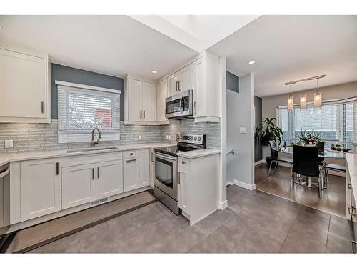 103 Windermere Road Sw, Calgary, AB - Indoor Photo Showing Kitchen With Upgraded Kitchen