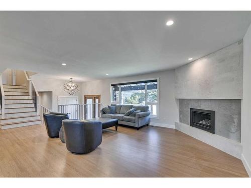 2203 Lancing Avenue Sw, Calgary, AB - Indoor Photo Showing Living Room With Fireplace