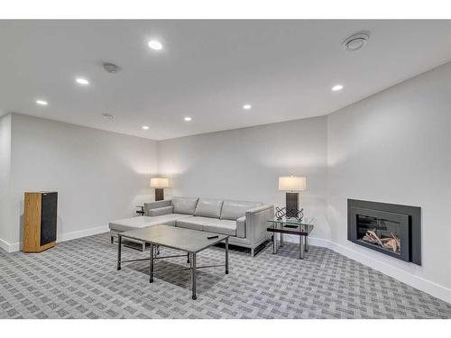 2203 Lancing Avenue Sw, Calgary, AB - Indoor Photo Showing Living Room With Fireplace