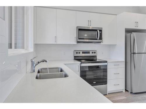 864 Cornerstone Boulevard Ne, Calgary, AB - Indoor Photo Showing Kitchen With Double Sink With Upgraded Kitchen