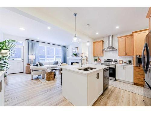 707 Buffaloberry Manor Se, Calgary, AB - Indoor Photo Showing Kitchen With Double Sink