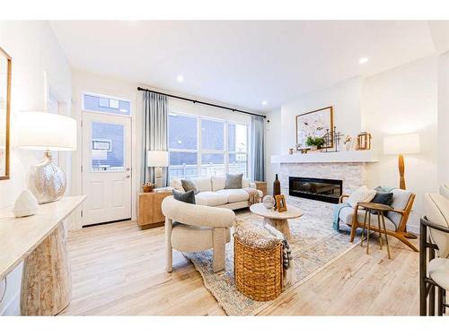 707 Buffaloberry Manor Se, Calgary, AB - Indoor Photo Showing Living Room With Fireplace