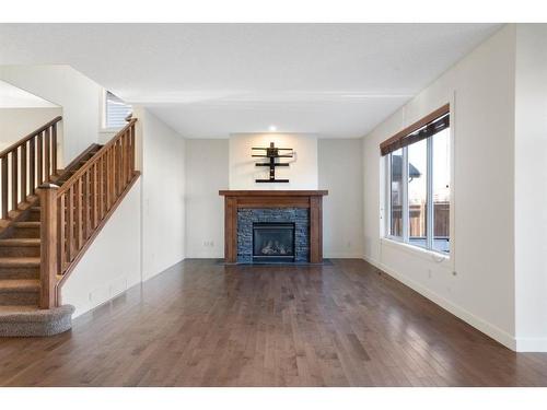 128 Elgin Estates Park Se, Calgary, AB - Indoor Photo Showing Living Room With Fireplace