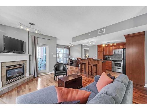 704-110 7 Street Sw, Calgary, AB - Indoor Photo Showing Living Room With Fireplace