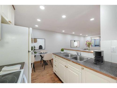 403-2734 17 Avenue Sw, Calgary, AB - Indoor Photo Showing Kitchen With Double Sink