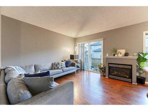 164 Stonemere Place, Chestermere, AB - Indoor Photo Showing Living Room With Fireplace