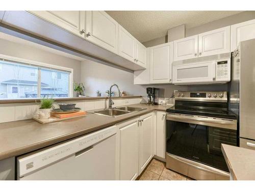 164 Stonemere Place, Chestermere, AB - Indoor Photo Showing Kitchen With Double Sink