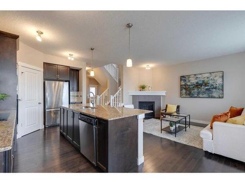 1170 Kings Heights Way Se, Airdrie, AB - Indoor With Fireplace