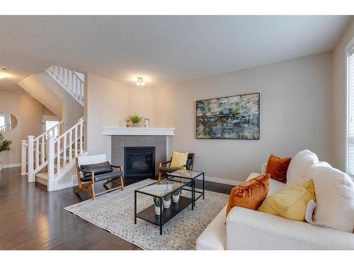 1170 Kings Heights Way Se, Airdrie, AB - Indoor Photo Showing Living Room With Fireplace