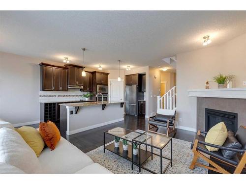 1170 Kings Heights Way Se, Airdrie, AB - Indoor Photo Showing Living Room With Fireplace