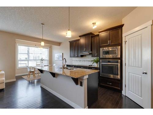 1170 Kings Heights Way Se, Airdrie, AB - Indoor Photo Showing Kitchen With Double Sink With Upgraded Kitchen