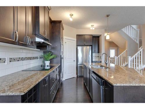 1170 Kings Heights Way Se, Airdrie, AB - Indoor Photo Showing Kitchen With Double Sink With Upgraded Kitchen