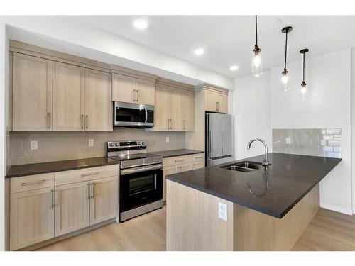 6414-20295 Seton Way Se, Calgary, AB - Indoor Photo Showing Kitchen With Stainless Steel Kitchen With Double Sink With Upgraded Kitchen