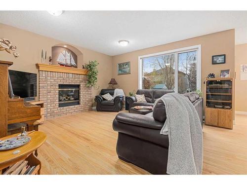 55 Chapman Way Se, Calgary, AB - Indoor Photo Showing Living Room With Fireplace