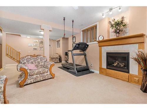 55 Chapman Way Se, Calgary, AB - Indoor Photo Showing Other Room With Fireplace