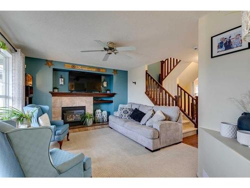 10 Silverado Plains Manor Sw, Calgary, AB - Indoor Photo Showing Living Room With Fireplace