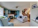 10 Silverado Plains Manor Sw, Calgary, AB  - Indoor Photo Showing Living Room With Fireplace 