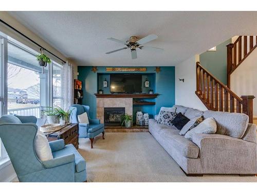 10 Silverado Plains Manor Sw, Calgary, AB - Indoor Photo Showing Living Room With Fireplace