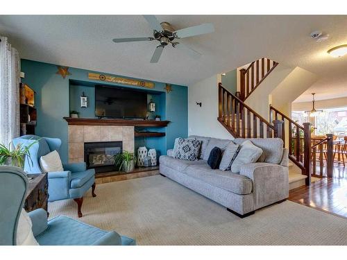 10 Silverado Plains Manor Sw, Calgary, AB - Indoor Photo Showing Living Room With Fireplace