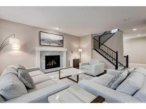 32 Chaparral Valley Terrace Se, Calgary, AB - Indoor Photo Showing Living Room With Fireplace