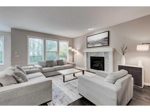 32 Chaparral Valley Terrace Se, Calgary, AB - Indoor Photo Showing Living Room With Fireplace