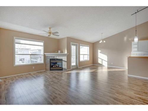 126 Mt Douglas Villas Se, Calgary, AB - Indoor Photo Showing Living Room With Fireplace