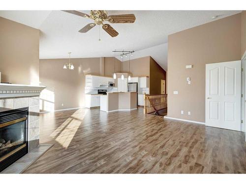 126 Mt Douglas Villas Se, Calgary, AB - Indoor Photo Showing Living Room With Fireplace